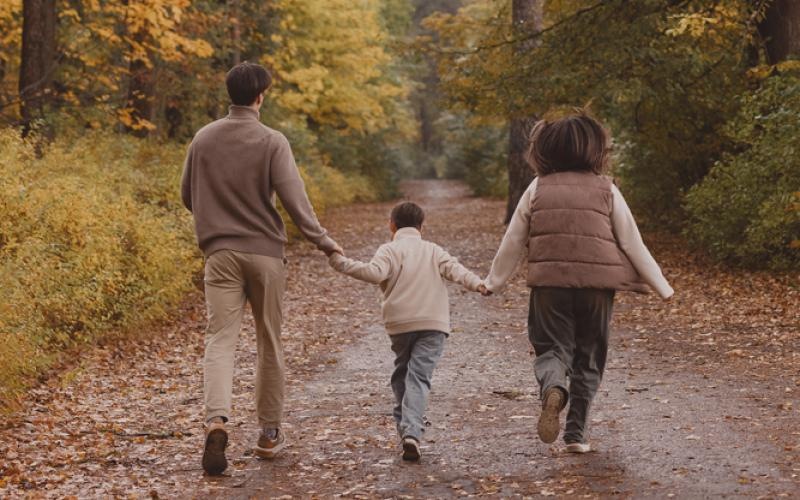a family walking down a path